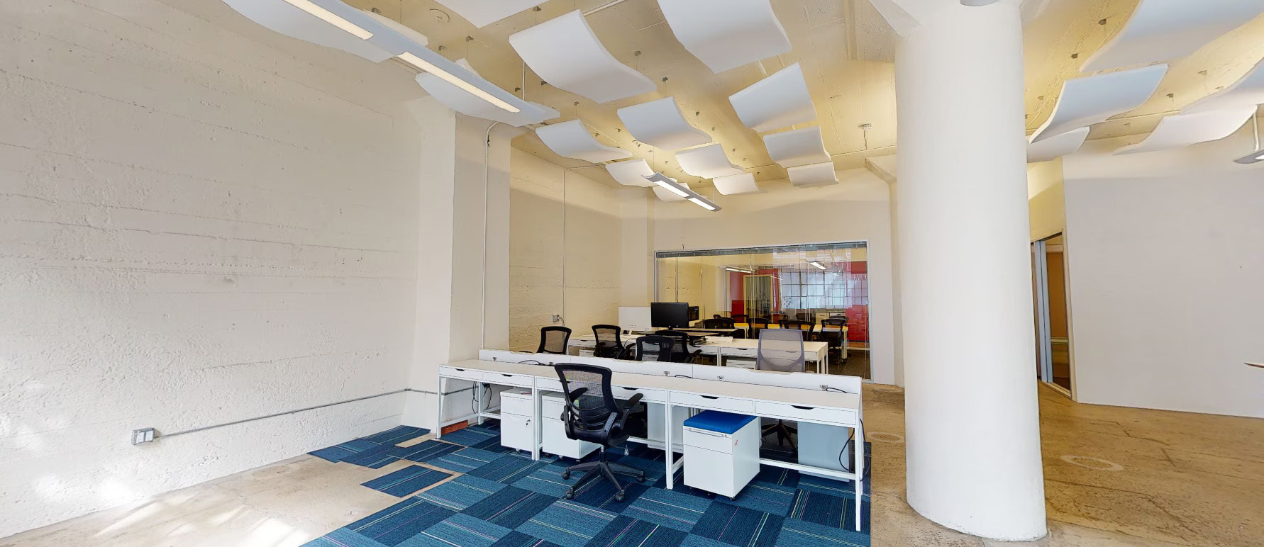 Open workspace with sit/stand desks